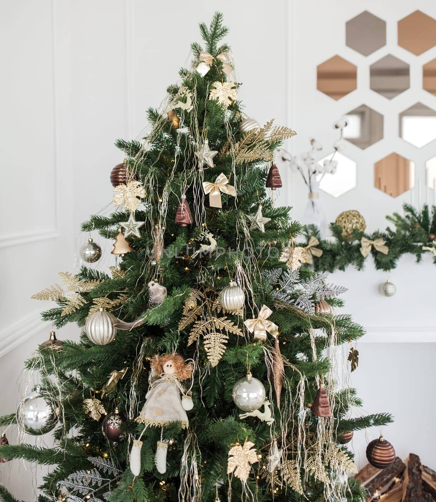 beautiful christmas tree decorated with baubles and many different presents