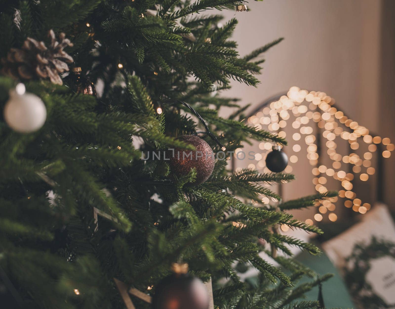 beautifully decorated Christmas tree with balloons in a cozy home environment