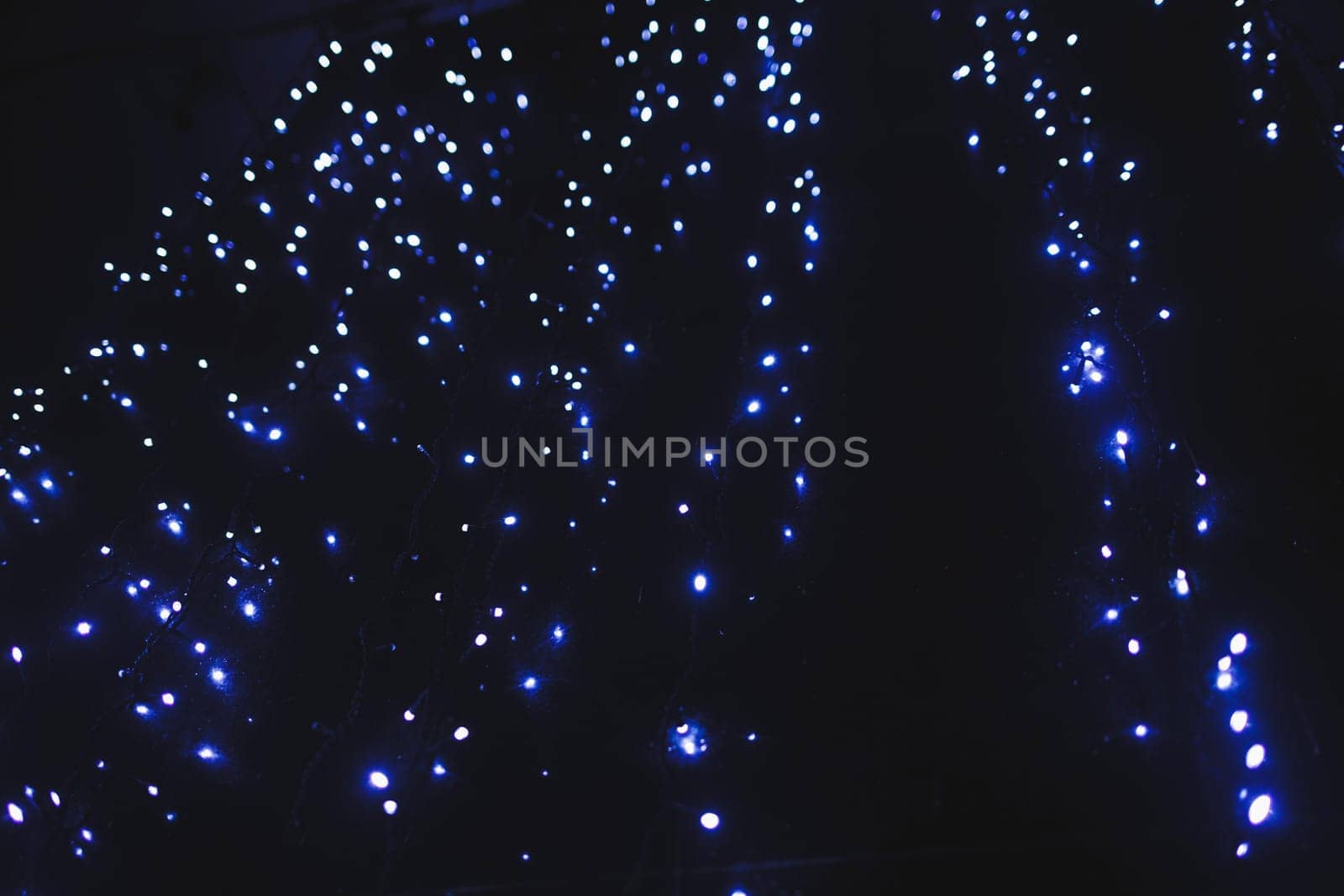 blue lights in the night city. Christmas