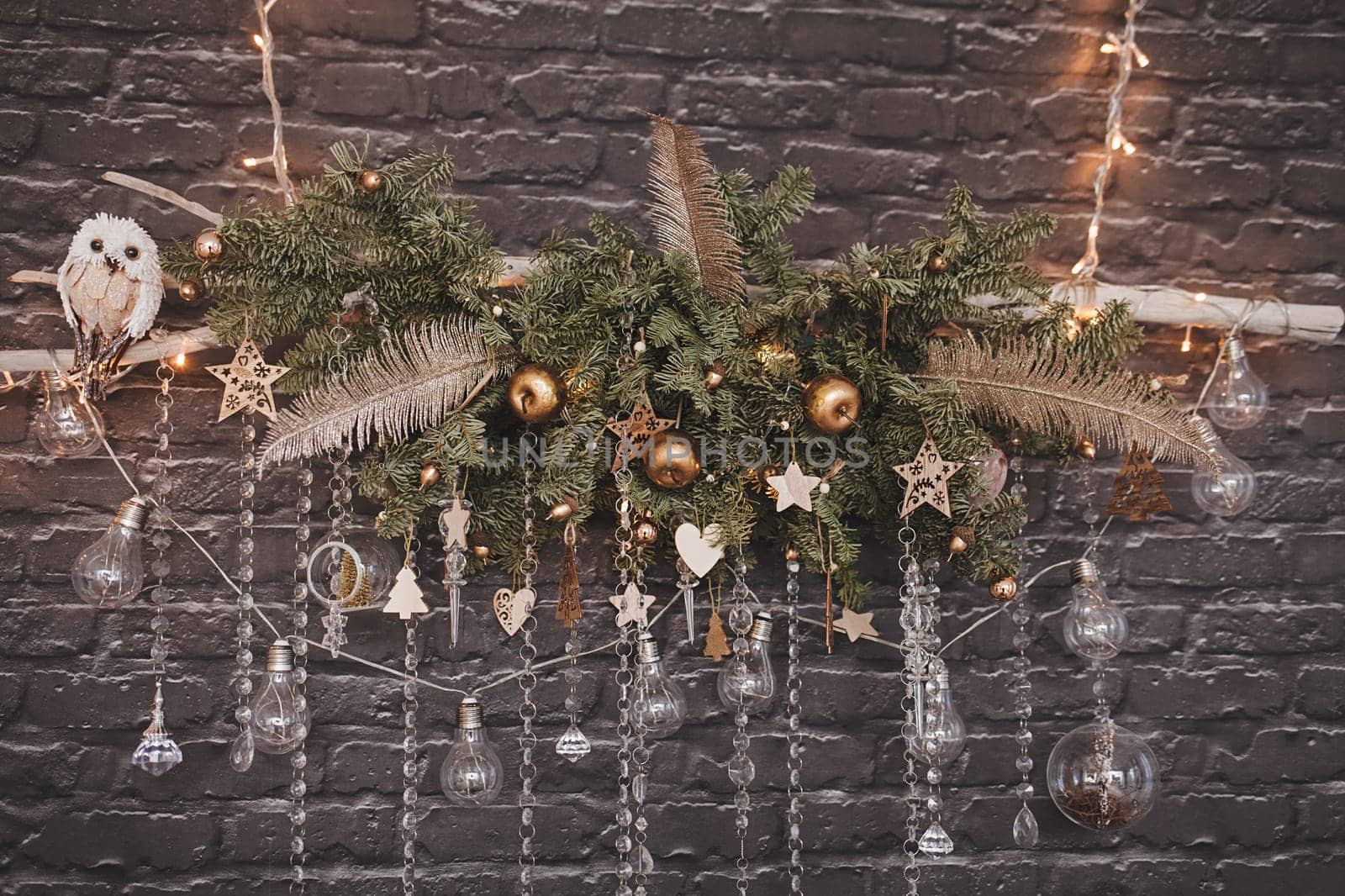 composition of light bulbs and balls on a Christmas decoration hanging on the wall