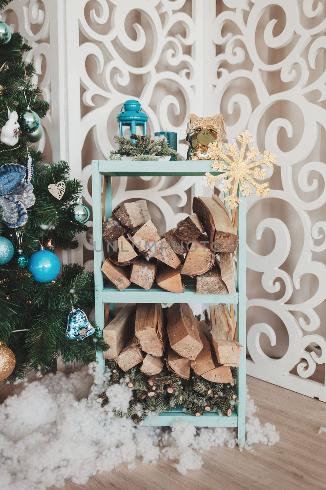 cozy room with firewood decorated for Christmas