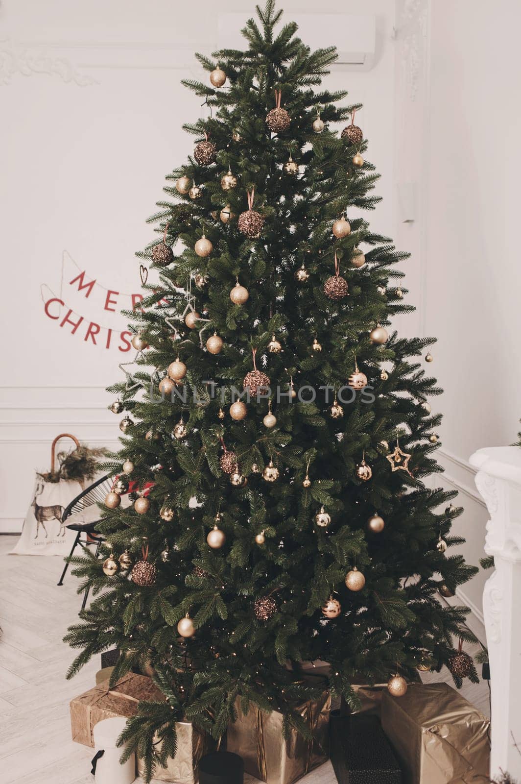 Merry Christmas and Happy Holidays. Decoration the Christmas tree indoors.