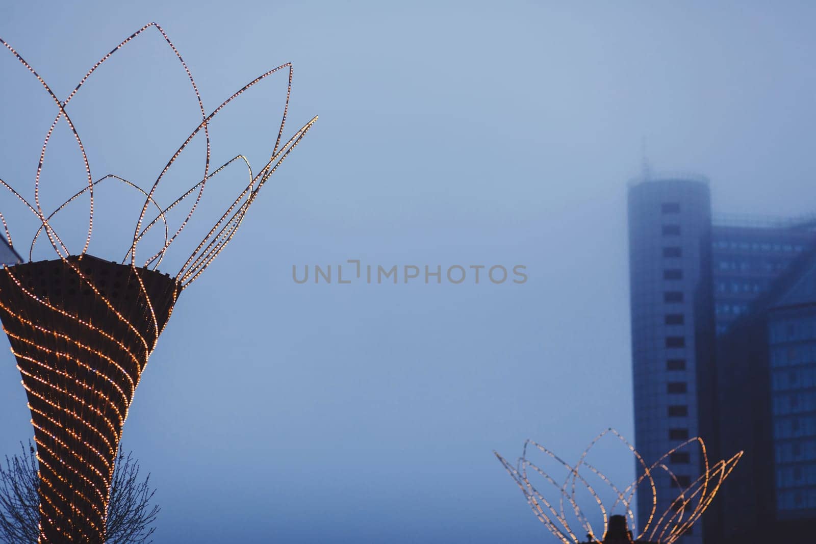 Christmas illumination on the background of a foggy city