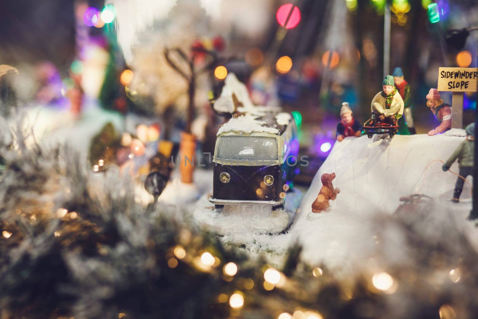 miniature image of Christmas scene-retro bus and people with sleds