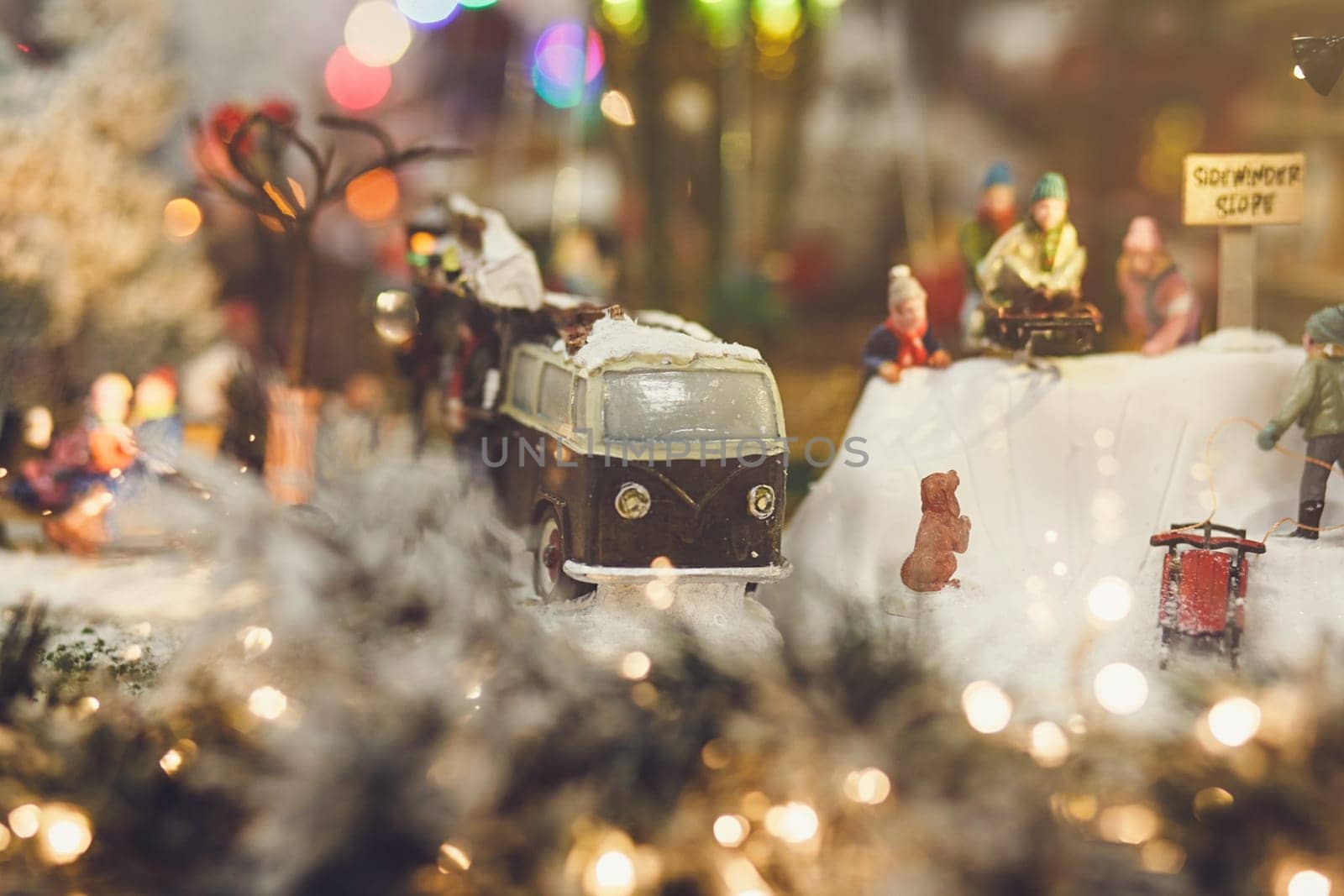 Christmas concept-miniature retro car on the background of people