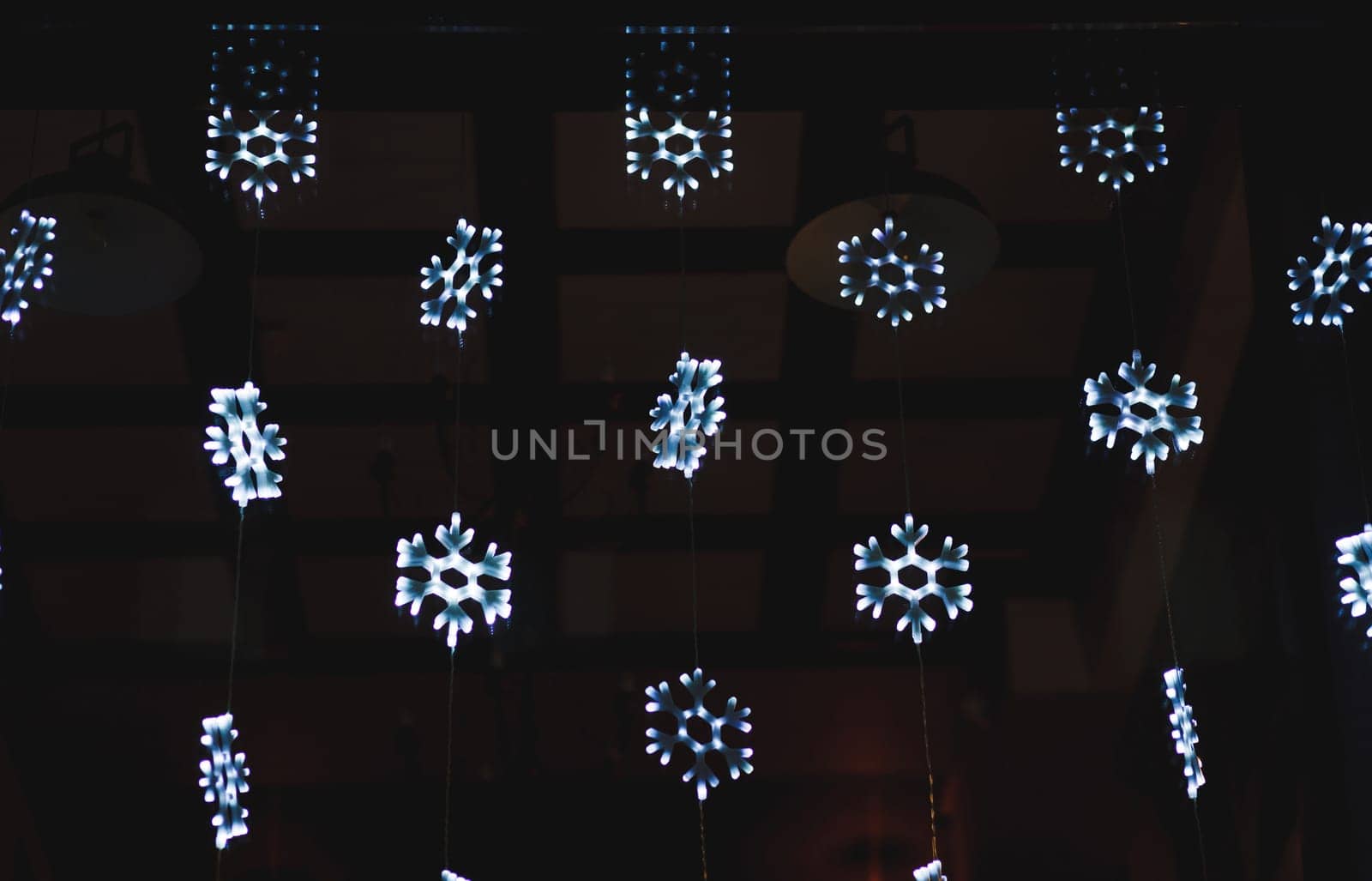 Christmas glowing snowflakes with copyspace on dark background