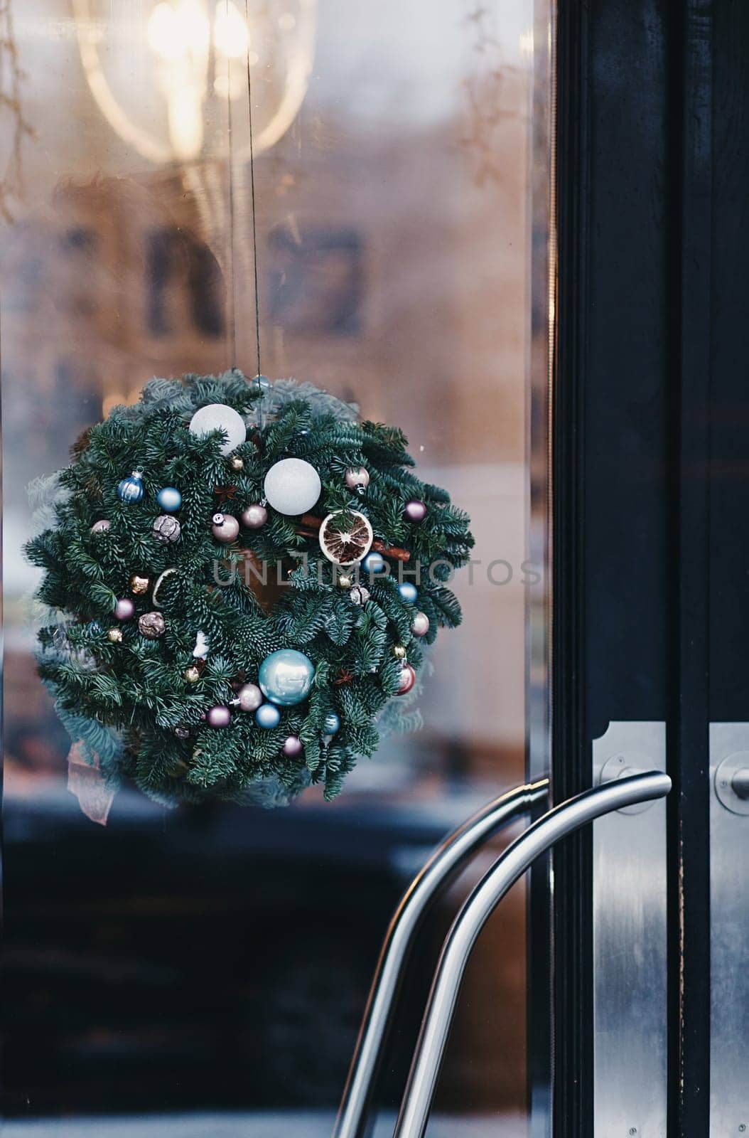 Christmas decoration of the door of a European cafe. new year in the city