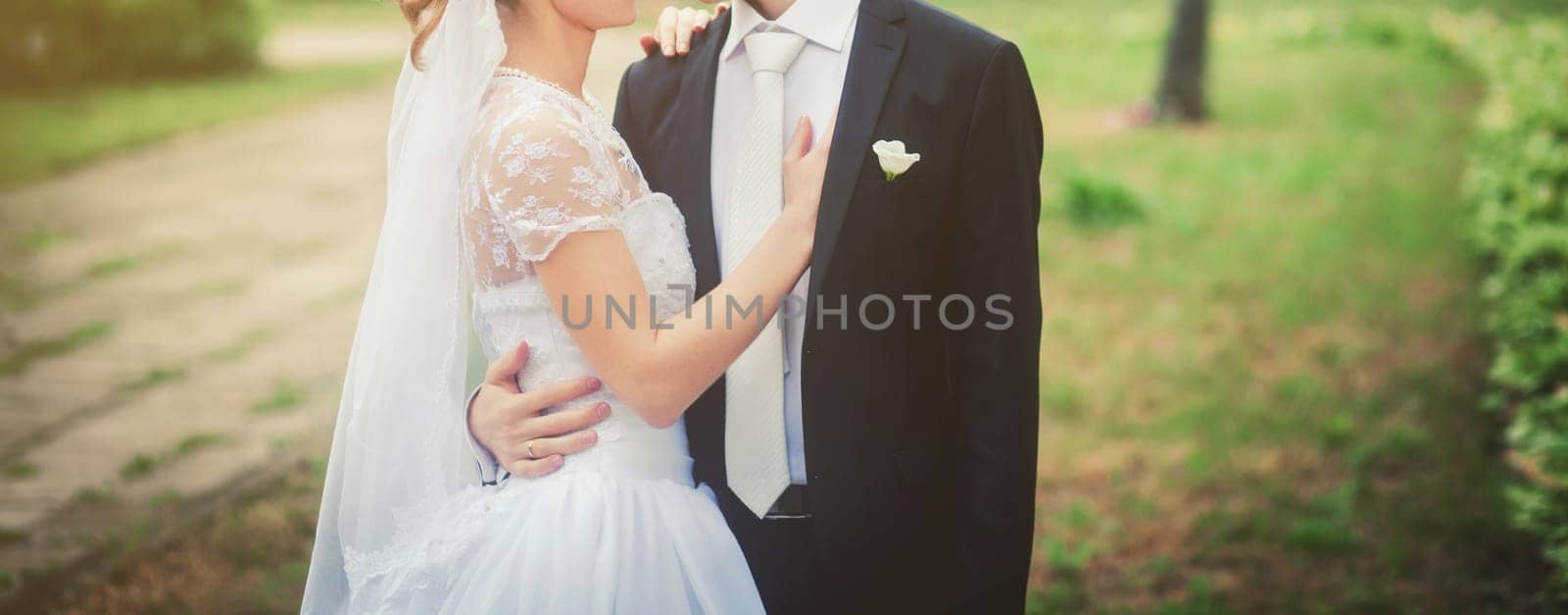 bride and groom hugging by Ladouski