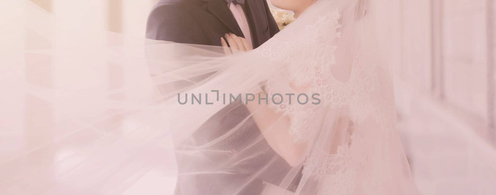 Young wedding couple. Bride and groom embracing at wedding day