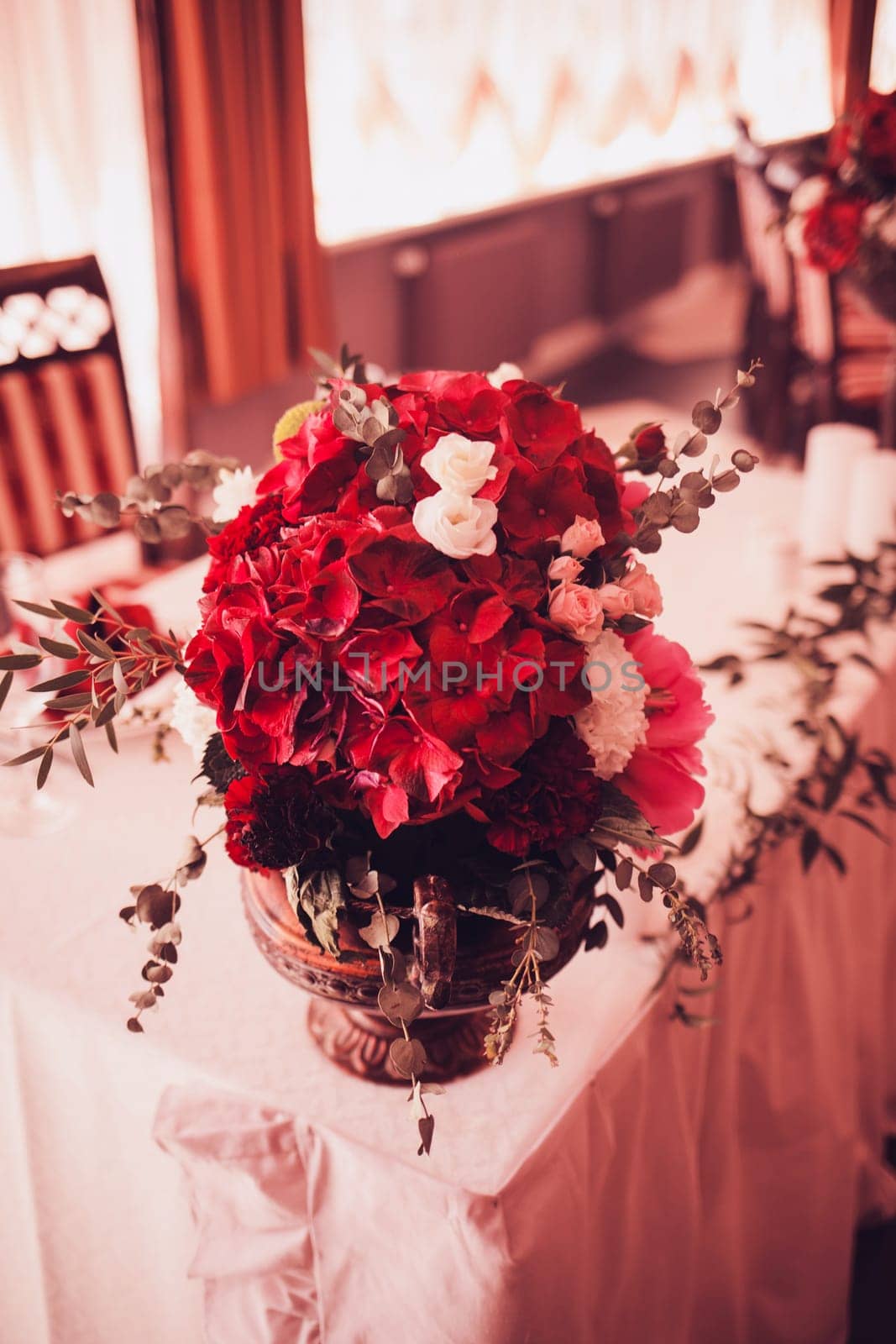 red bouquet with flowers on the wedding table
