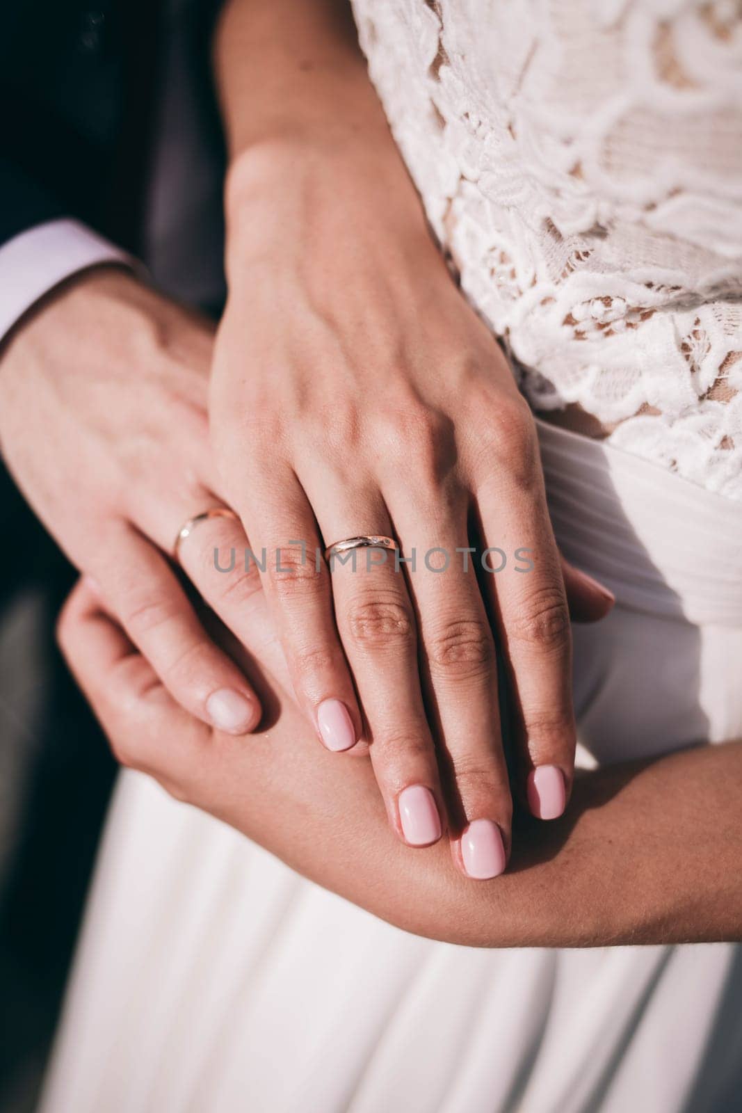 Newly couple's hands with wedding rings