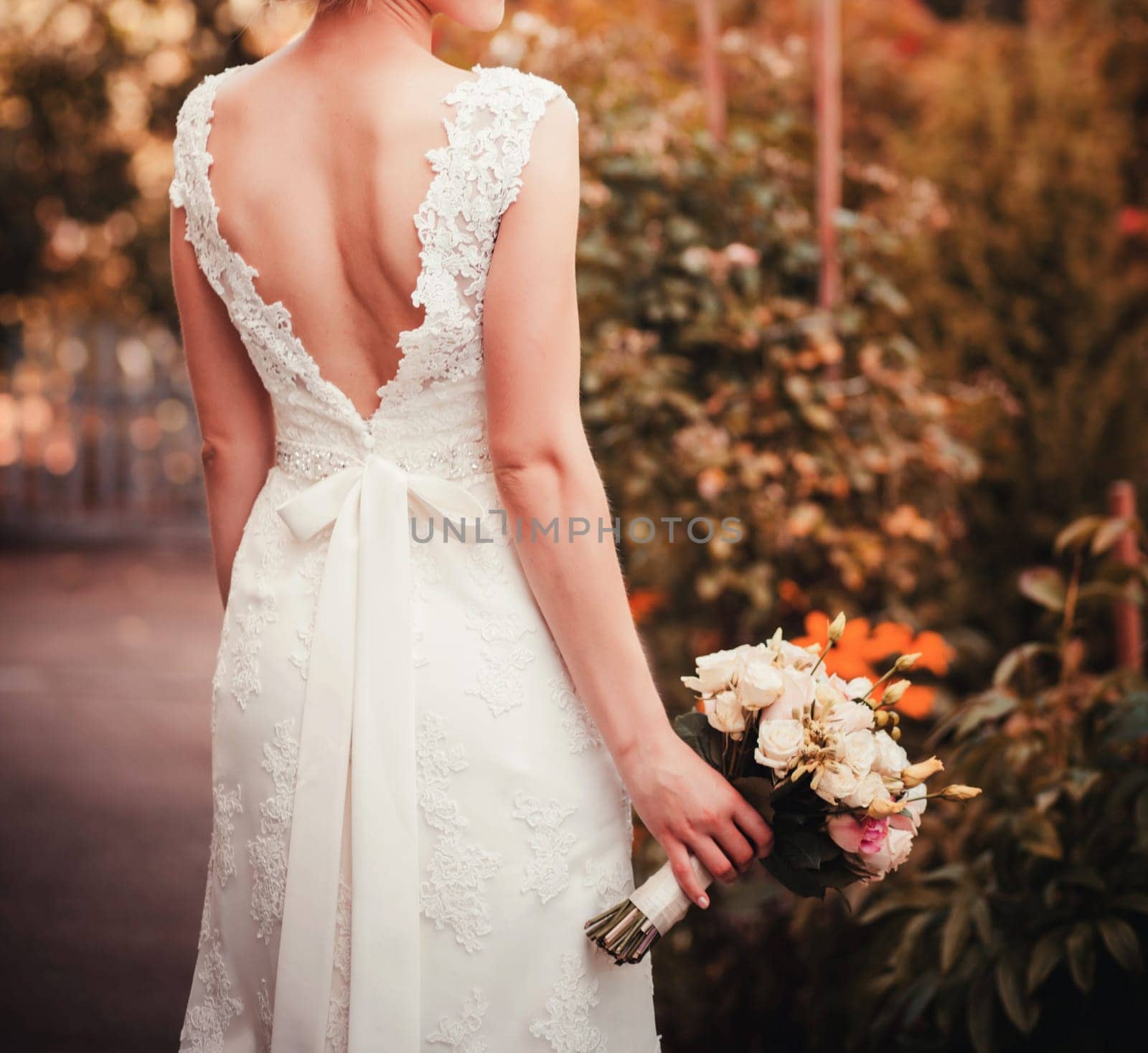  beautiful colorful wedding bouquet in a hand of a bride