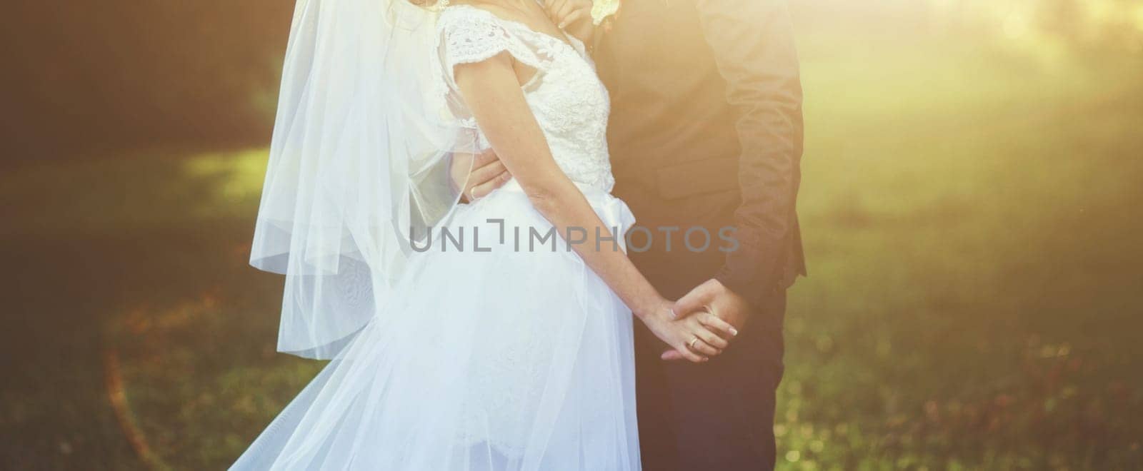 Young wedding couple enjoying romantic moments on meadow