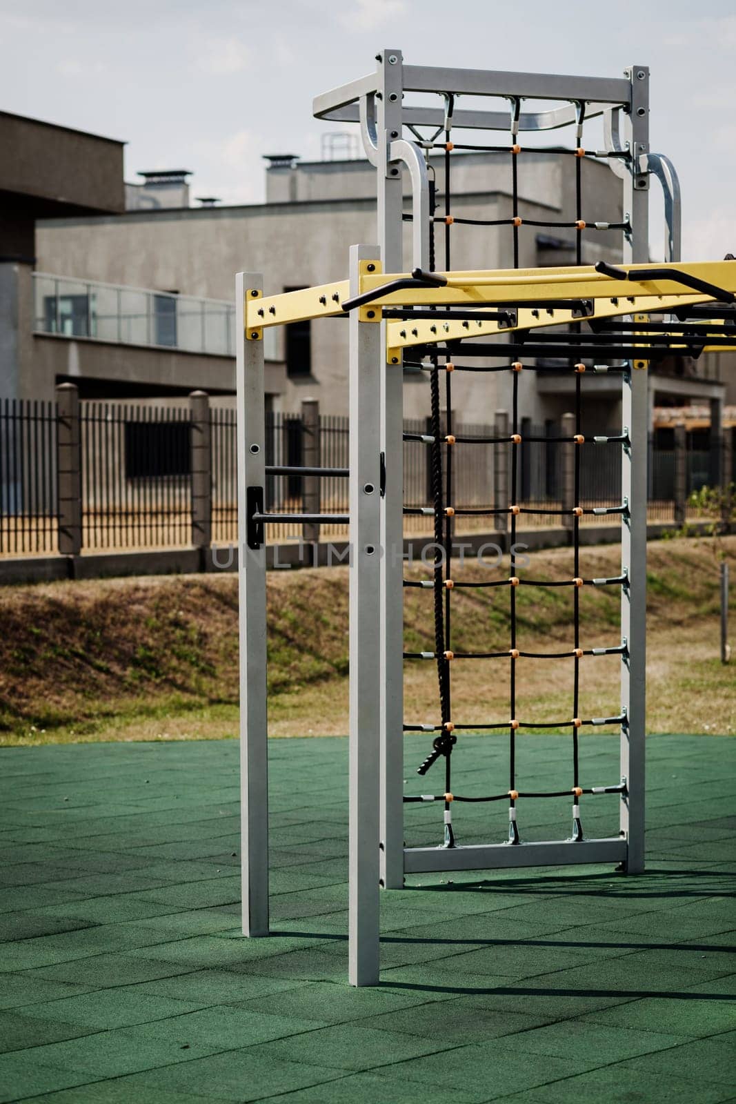 empty playground with horizontal bars, crossbeams and parallel bars. Outdoor sports in nature in the city green park.