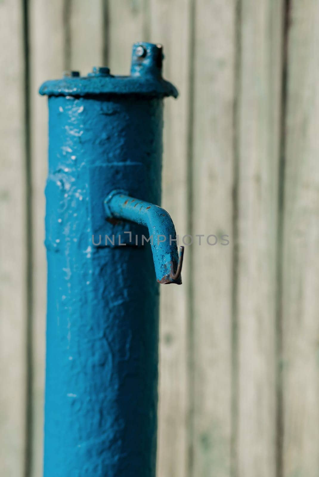 drinking column, blue water pump outdoors