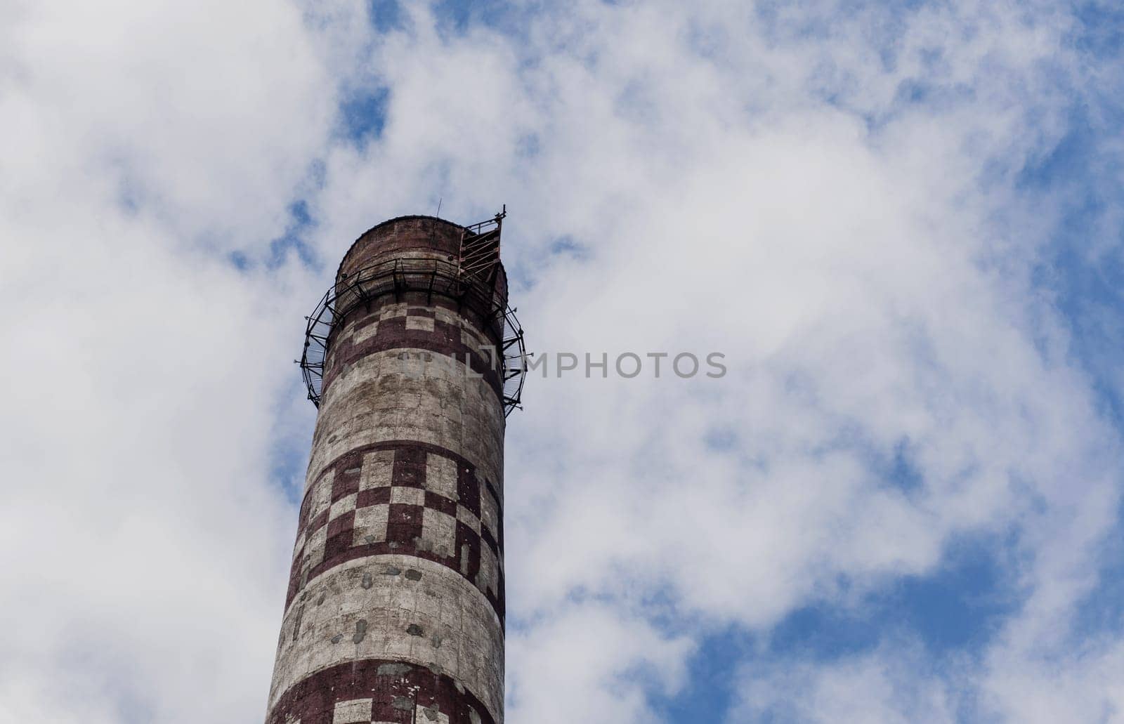 large industrial pipe against the sky. air pollution. space for text