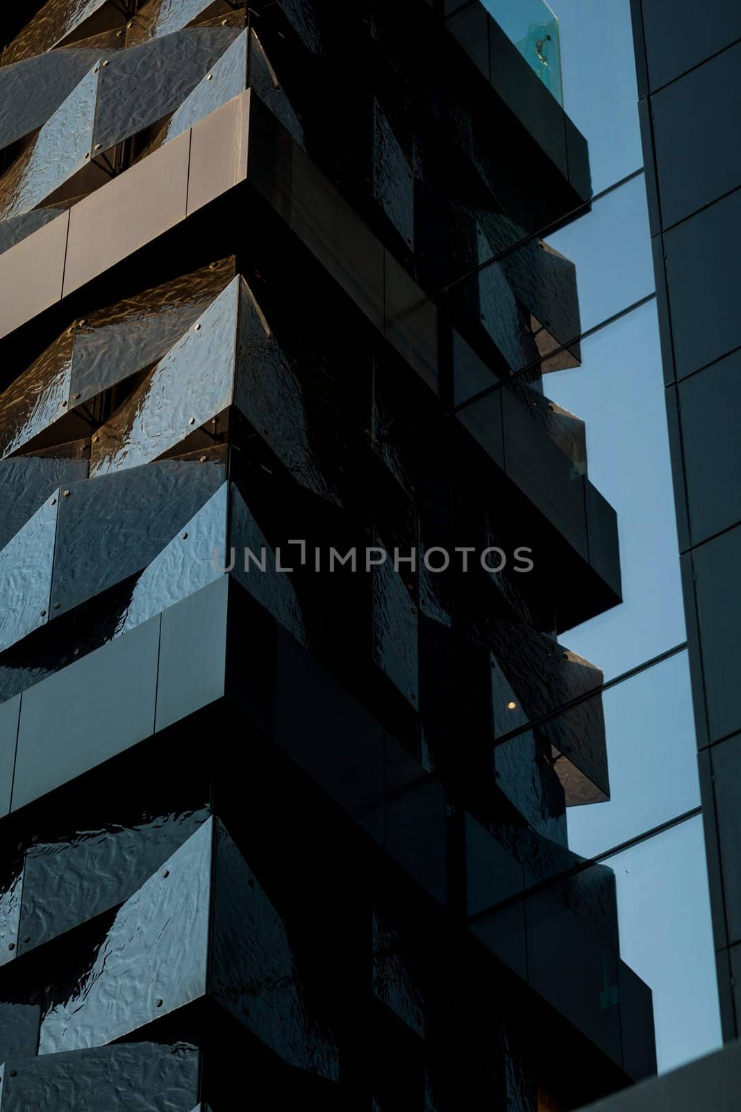 financial center. the futuristic facade of the building reflected in the windows