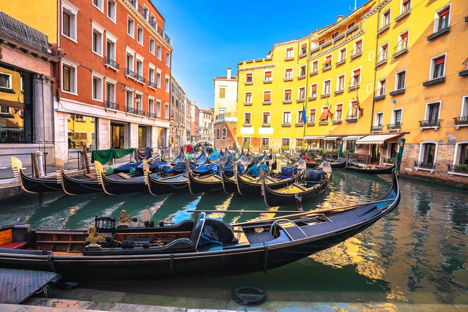 Bacino Orseolo channel gondolas and colorful architecture of Venice view, tourist destination in northern Iraly