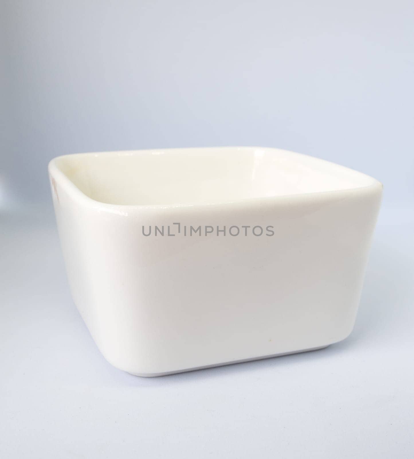The ceramic cup has been adapted for planting small pot plants by Satakorn