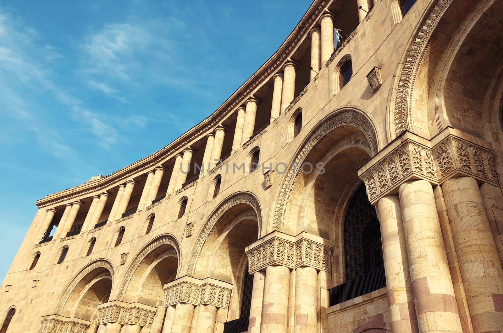 Historical architecture, facade of building with arches and columns on Republic Square in Yerevan, Armenia