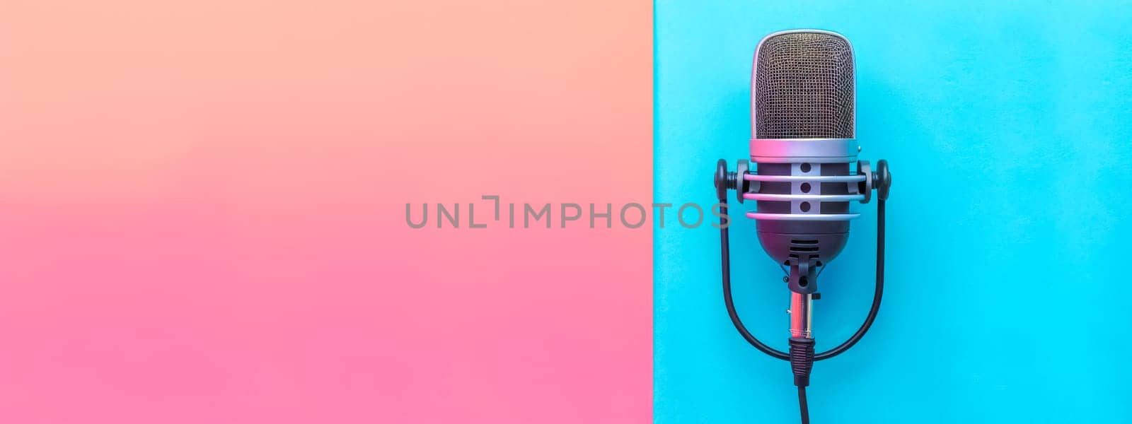 Vintage microphone on a dual-tone pastel background, ideal for podcasts or music themes