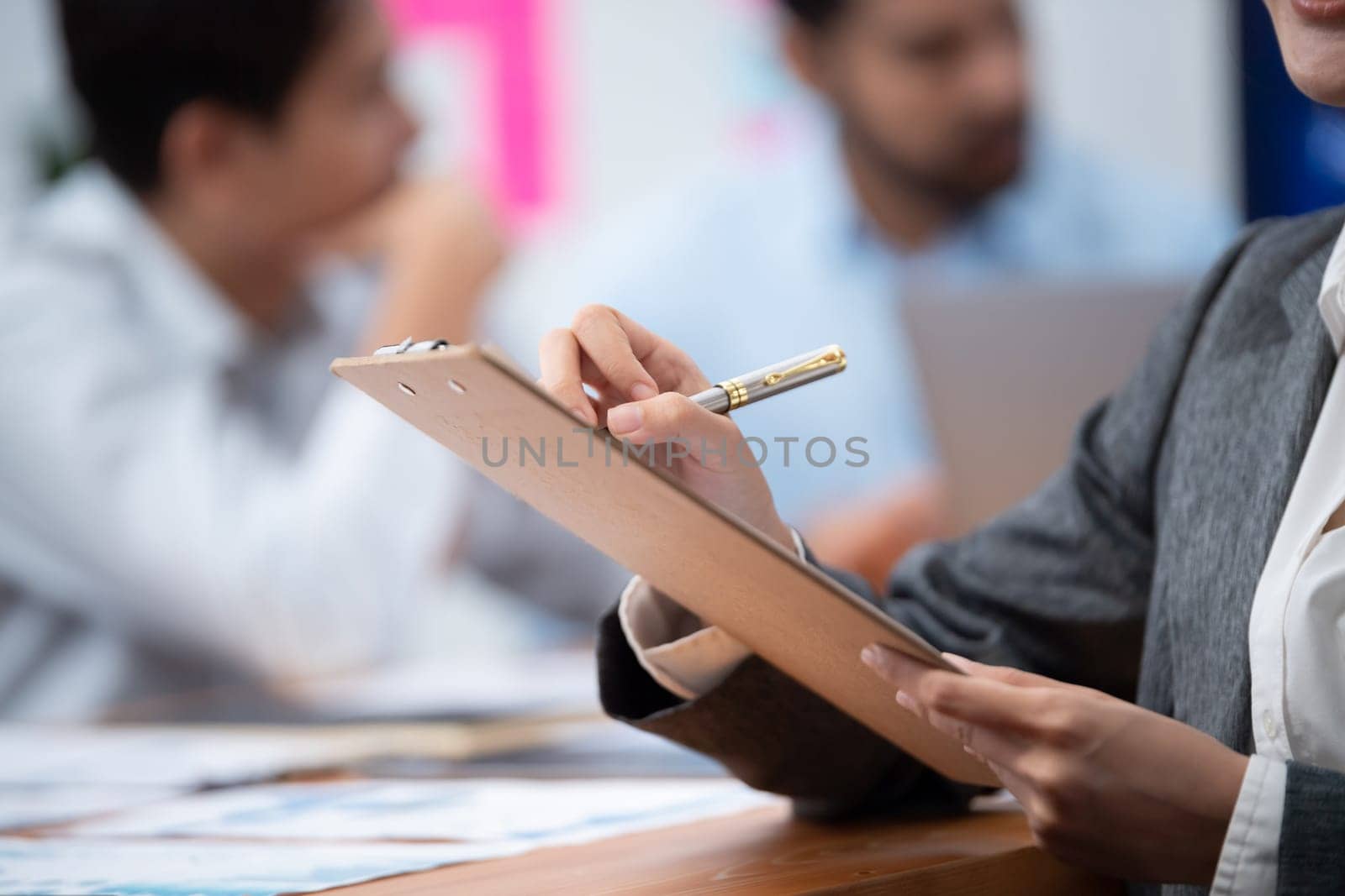 Analyst team writing and planning marketing using BI dashboard data to analyze financial report on meeting table. Business people utilize data analysis by FIntech for business decision. Concord