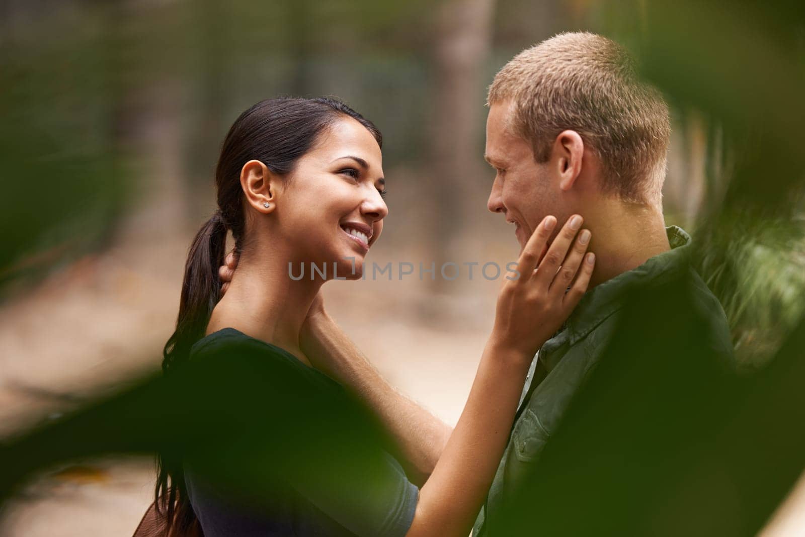 Park, hug and couple with love, smile and romance with marriage and celebration for anniversary. Outdoor, date and man with woman and relationship with vacation for honeymoon and nature with care by YuriArcurs