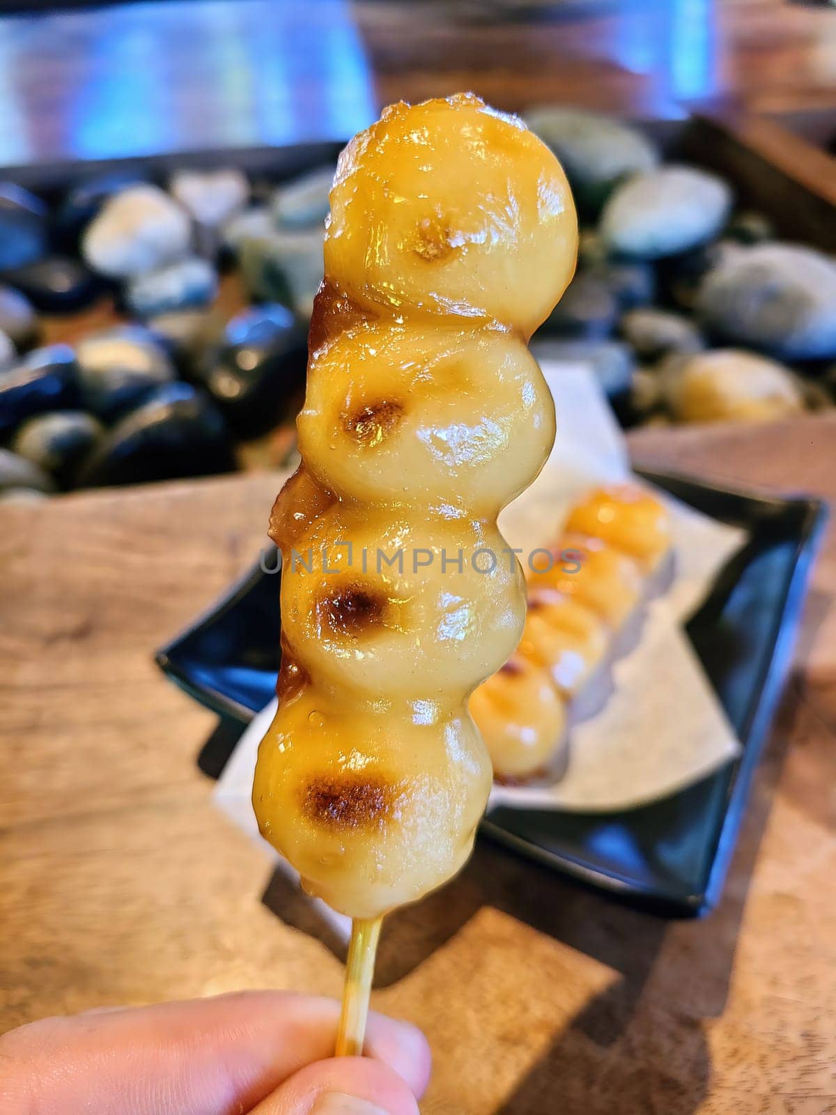 Delicious caramelized Dango skewers served in an authentic San Francisco Japanese restaurant, 2023