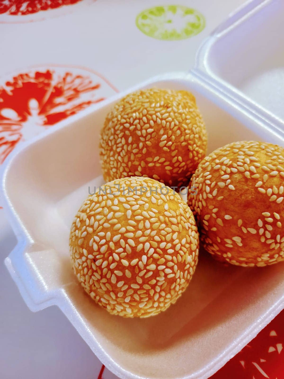 Freshly Fried Sesame Seed Balls in Louisville - A Glimpse of Asian Dessert Tradition in a Styrofoam Box