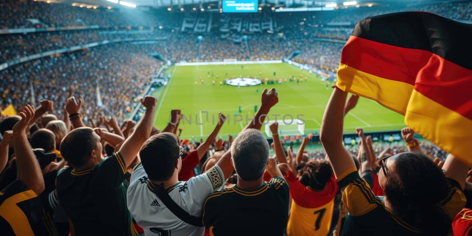 A fan at a world competition event raises his arms in the air, enjoying the fun and energy of the crowded stadium. AIG41