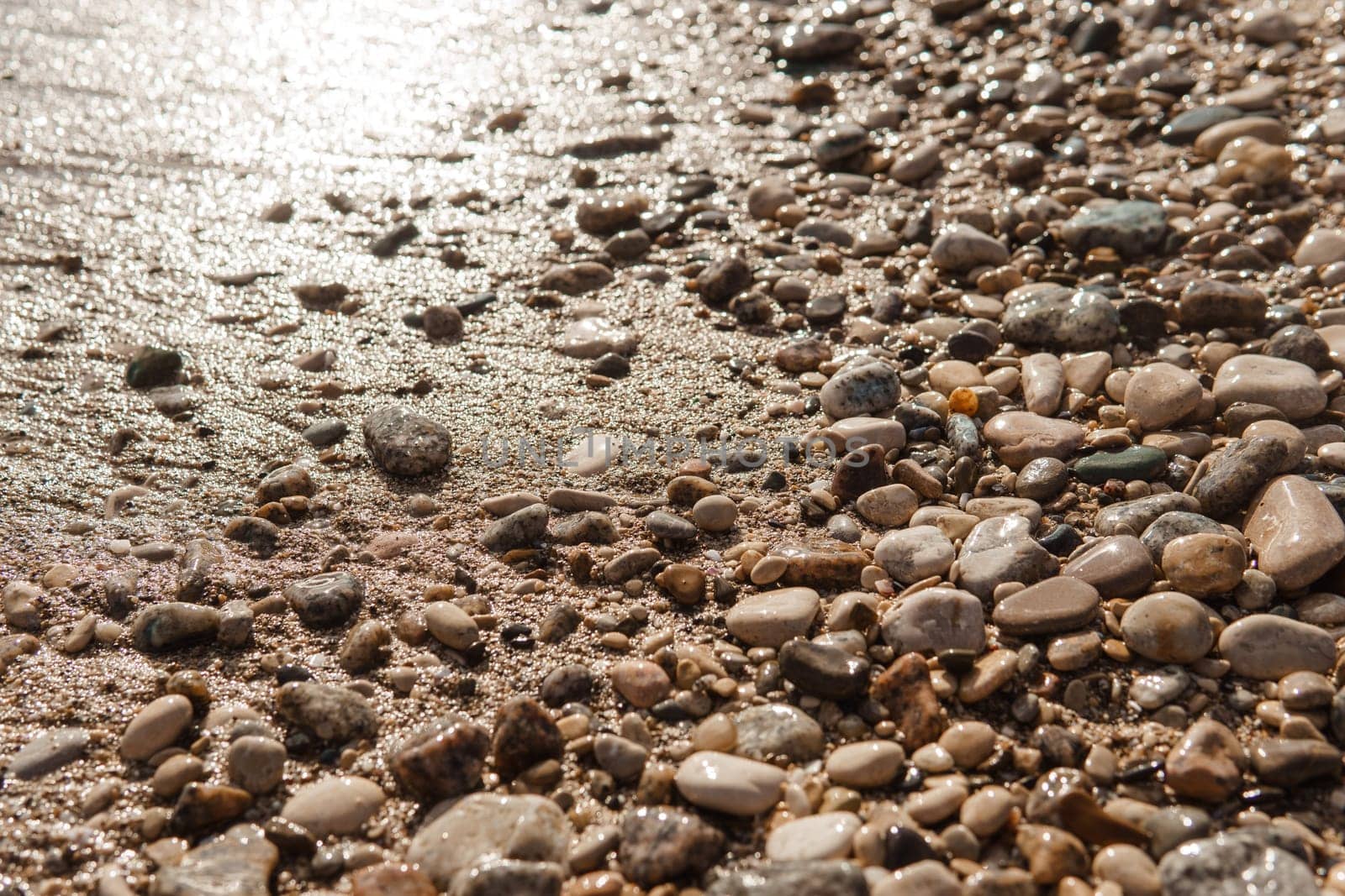 Pebbles on the seashore, close-up. Natural background