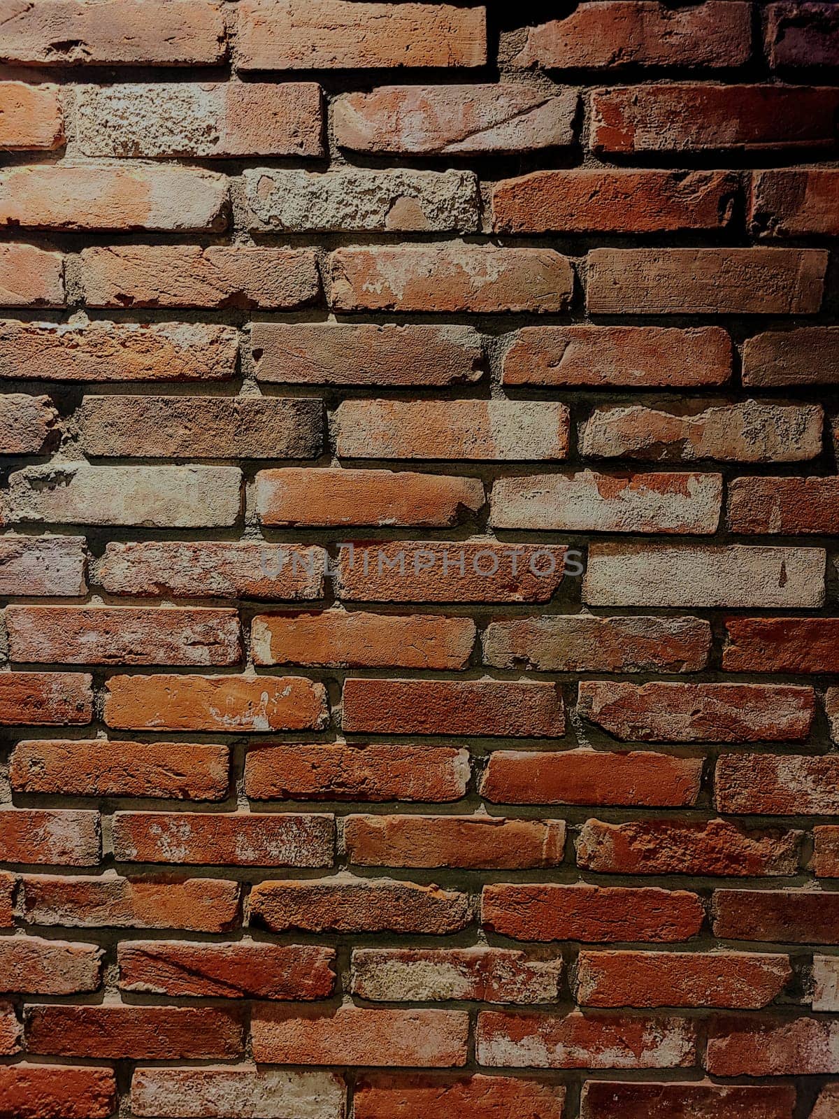 Close-up of traditional brick wall with rustic charm in Bloomington, Indiana, 2022, showcasing variation in texture and color at a Korean Fried Chicken restaurant.