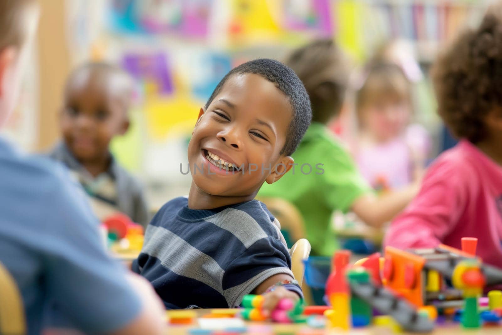 A young boy smiles brightly in a colorful classroom, embodying the success of inclusive education among his diverse peers. The classroom environment is vibrant and engaging, promoting a sense of community