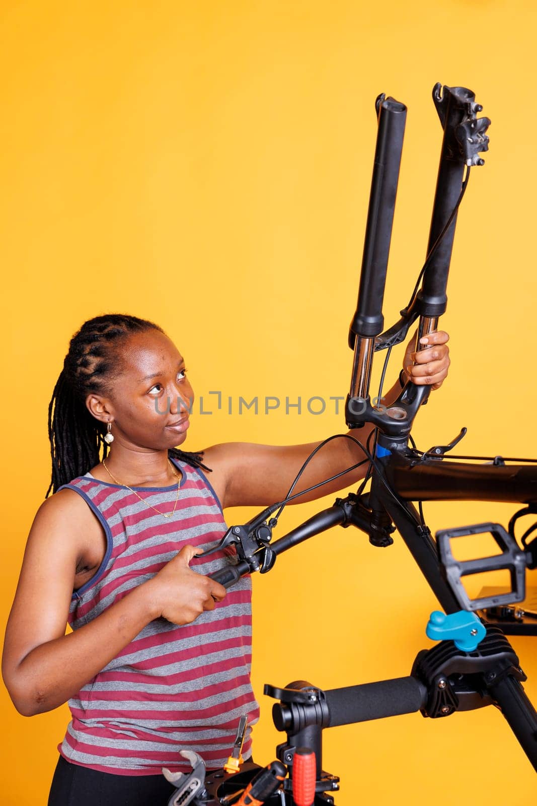 Female fixing disassembled bicycle by DCStudio
