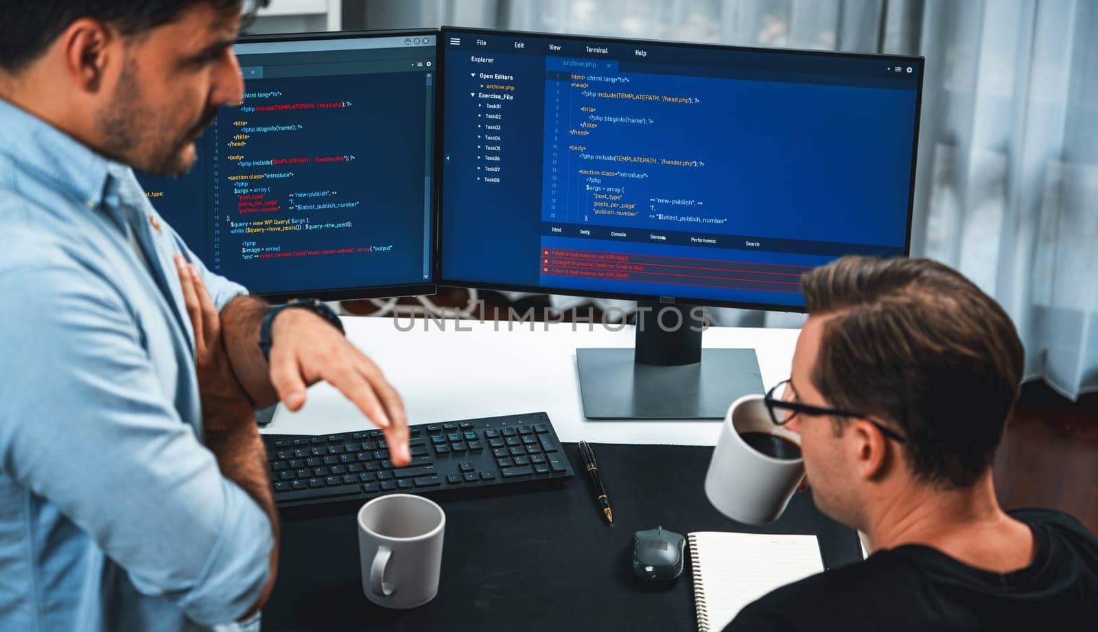 IT developers discussing online software development information on pc screen, creating program coding for latest version application on website. Concept of brainstorming firmware updated. Sellable.