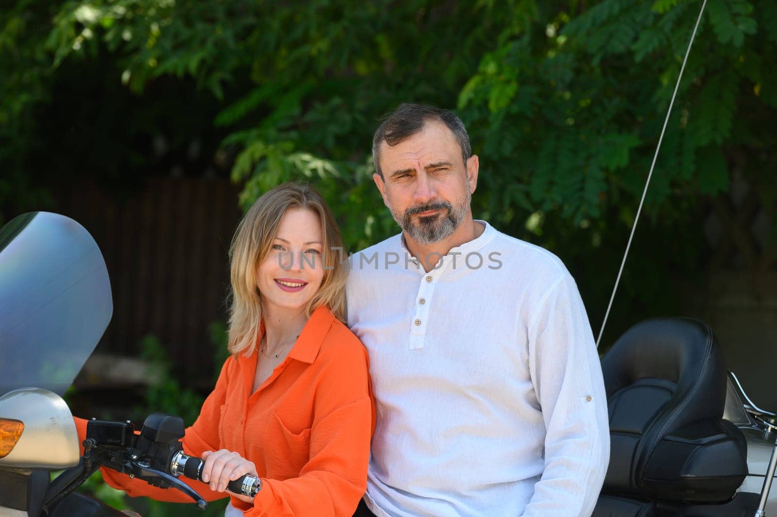 happy husband and wife near a motorcycle 1