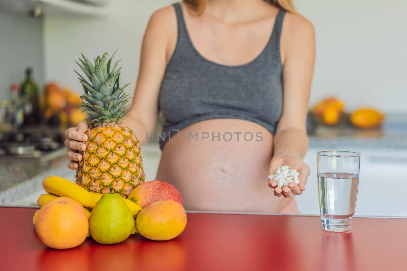 Balancing choices for optimal nutrition, a pregnant woman decides between the wholesome goodness of fresh fruits and the convenience of vitamin tablets, ensuring a well-rounded approach to her prenatal health by galitskaya