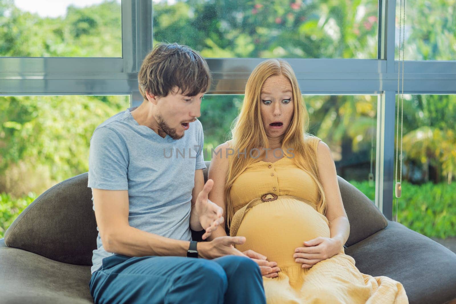 In a pivotal moment, the pregnant woman and father navigate the onset of contractions together, sharing the intensity and anticipation as they embark on the journey of welcoming their baby.