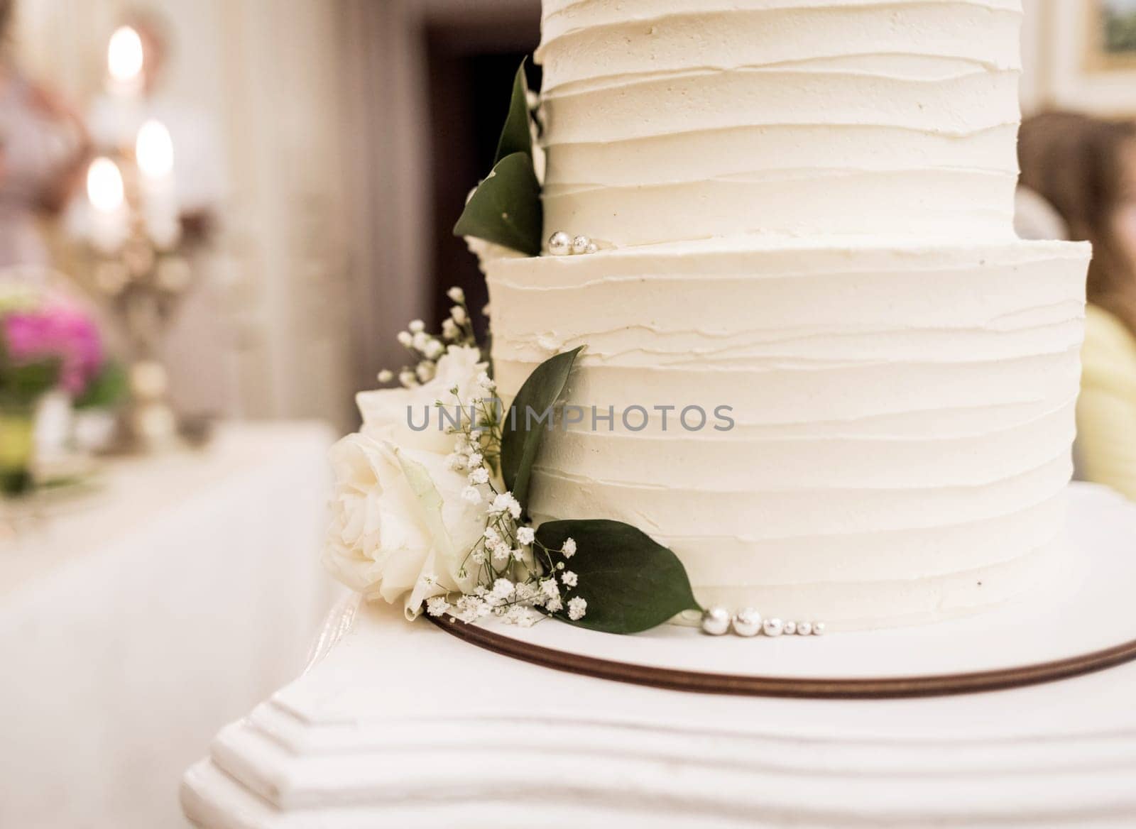 Beautiful and tasty wedding cake with flowers