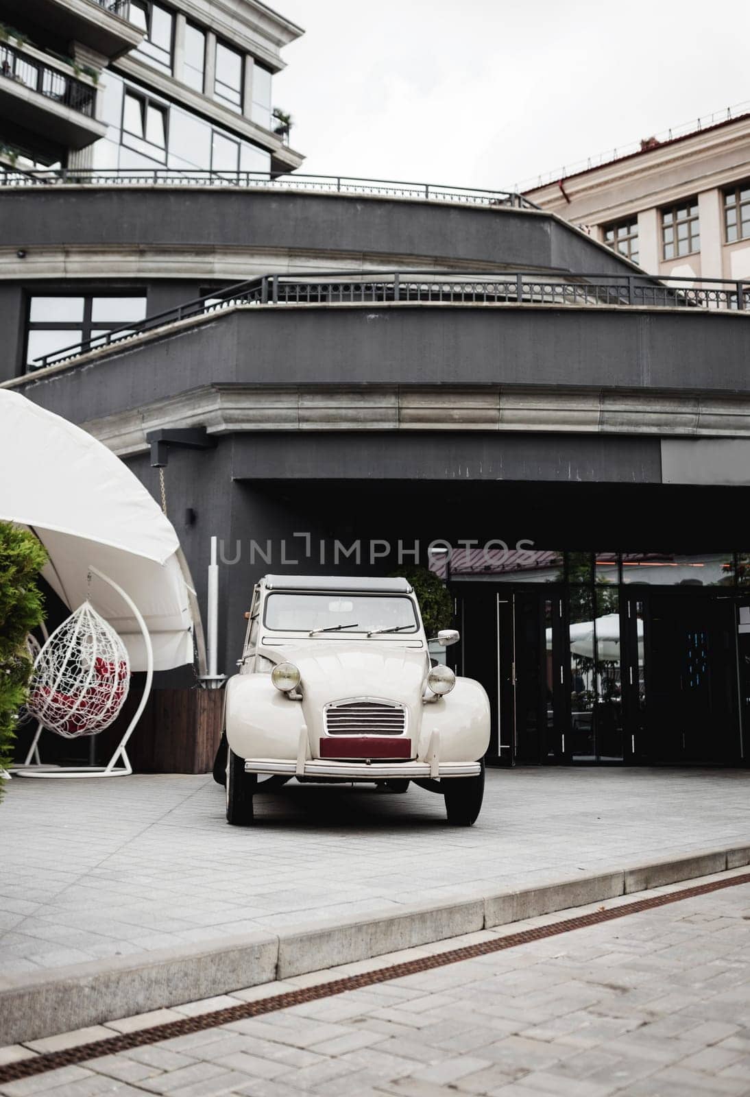 vintage car near a street cafe or hotel