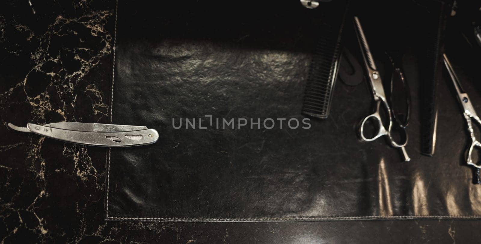 Barber shop tools on desk. dangerous razor