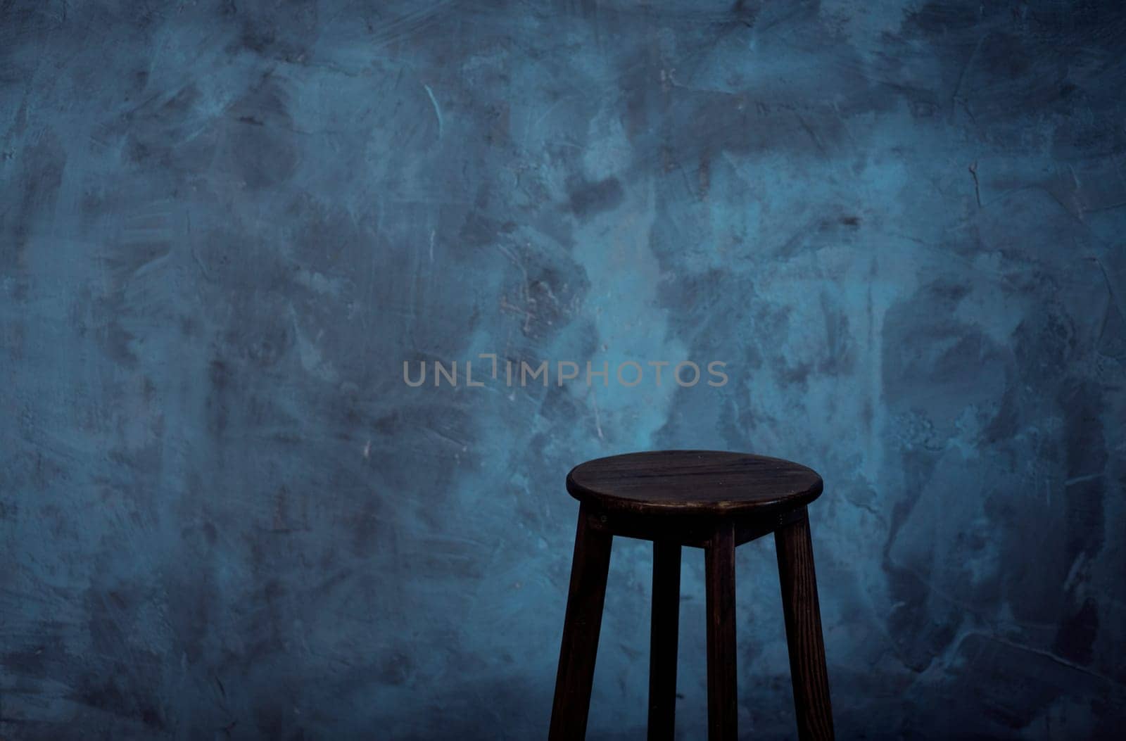 stylish chair made of wood in dark loft interior. copy space