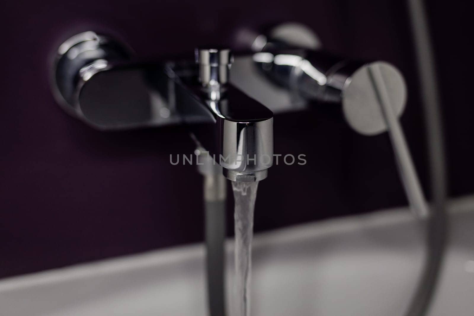 Interior of bathroom with sink basin silver faucet. Open chrome faucet washbasin. 