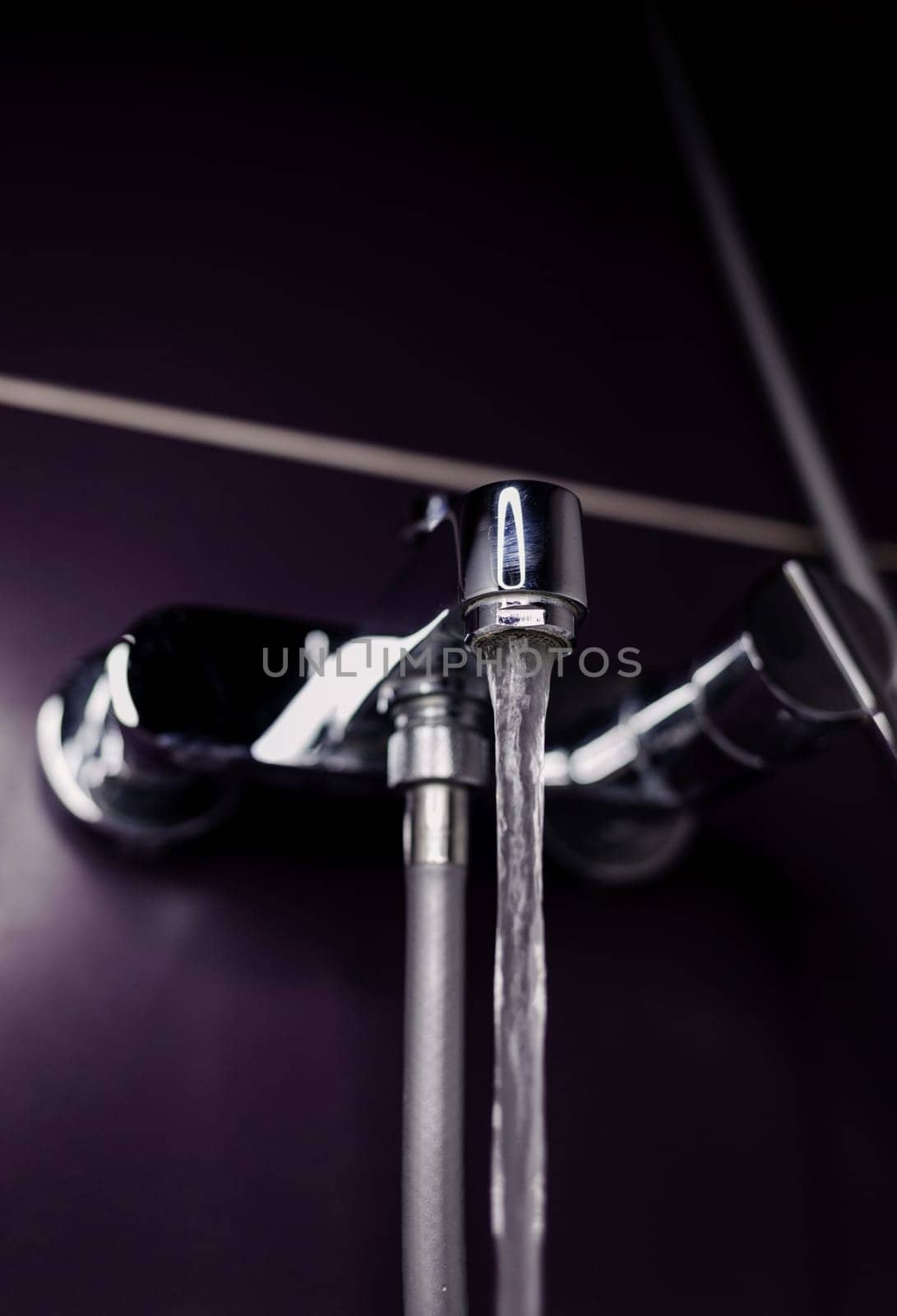 close-up tap or faucet in bathroom. water drop 
