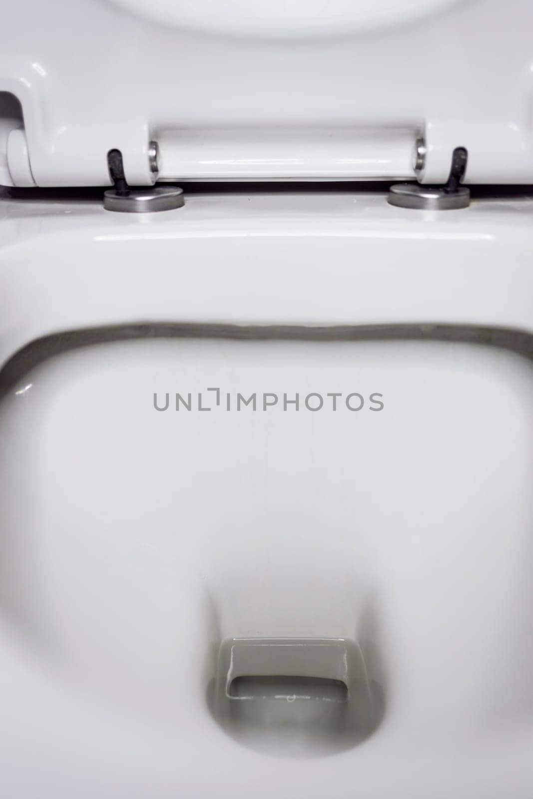 New ceramic toilet bowl indoors, top view. hygienic procedure