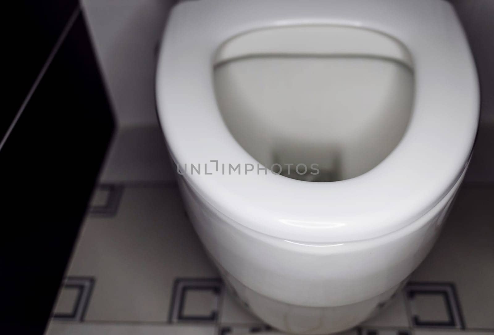 White toilet bowl in bathroom