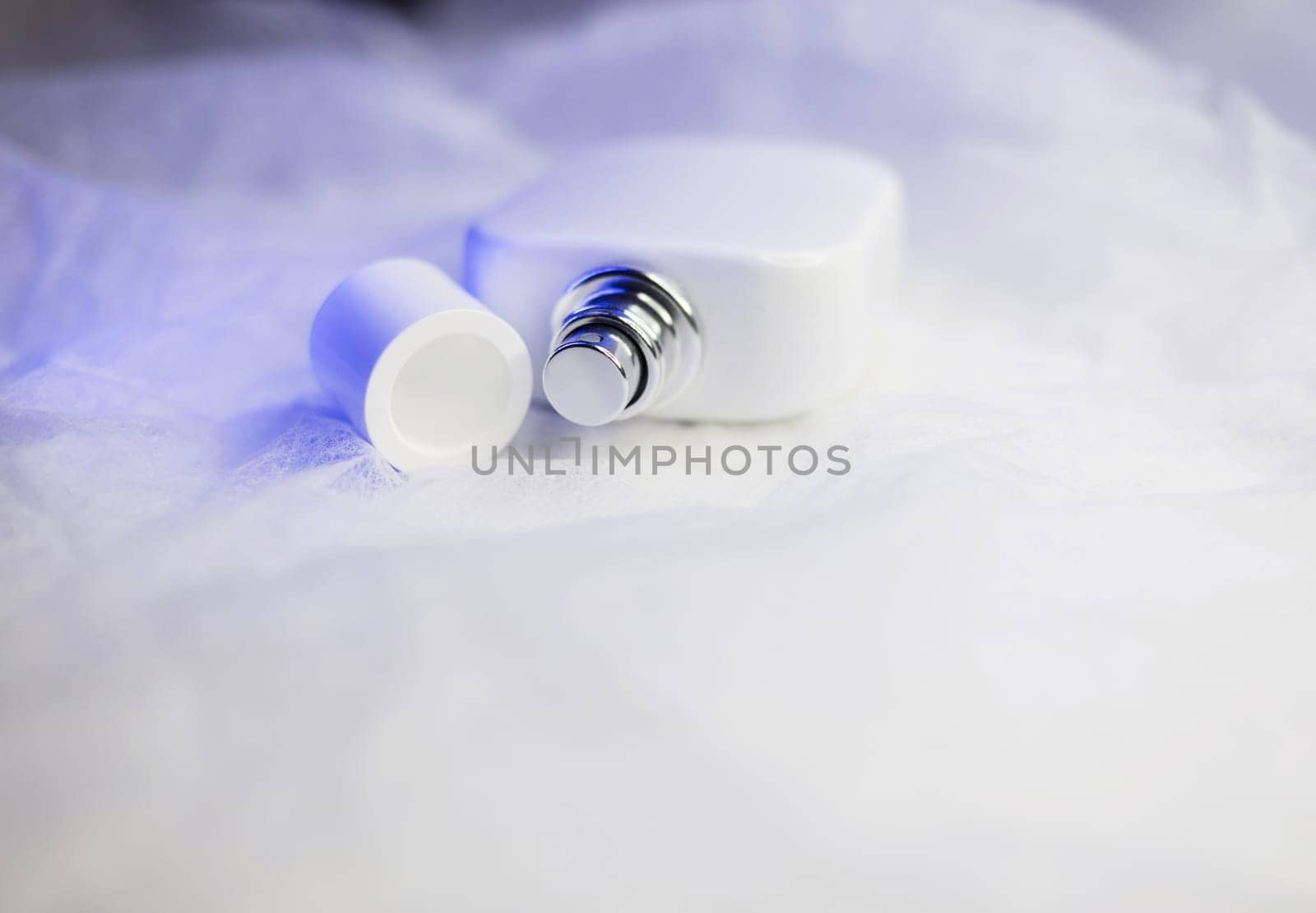 Female fragrance. White perfume bottle. aromatherapy