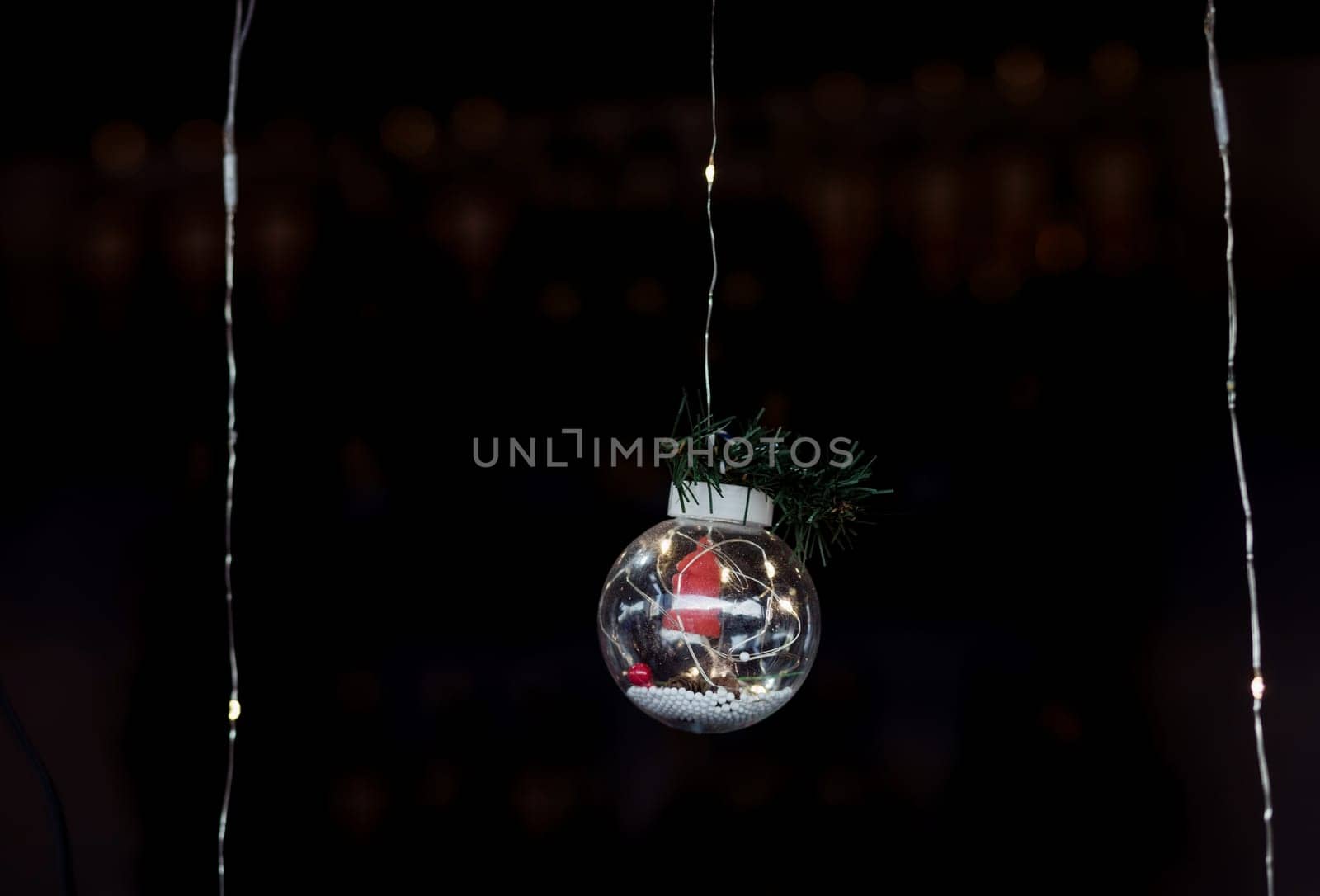 Clear Ball Ornament, small gift and christmas light inside.