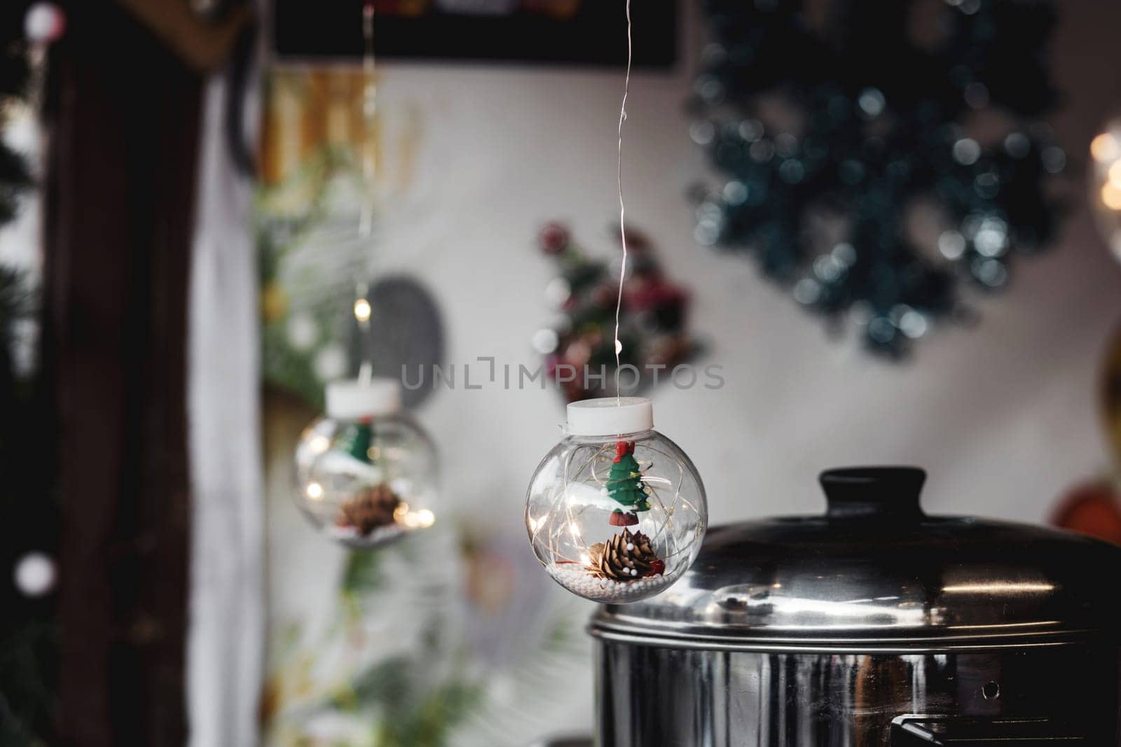 transparent Christmas ball with decor garland. DIY Christmas decorations. New Year's lighting.