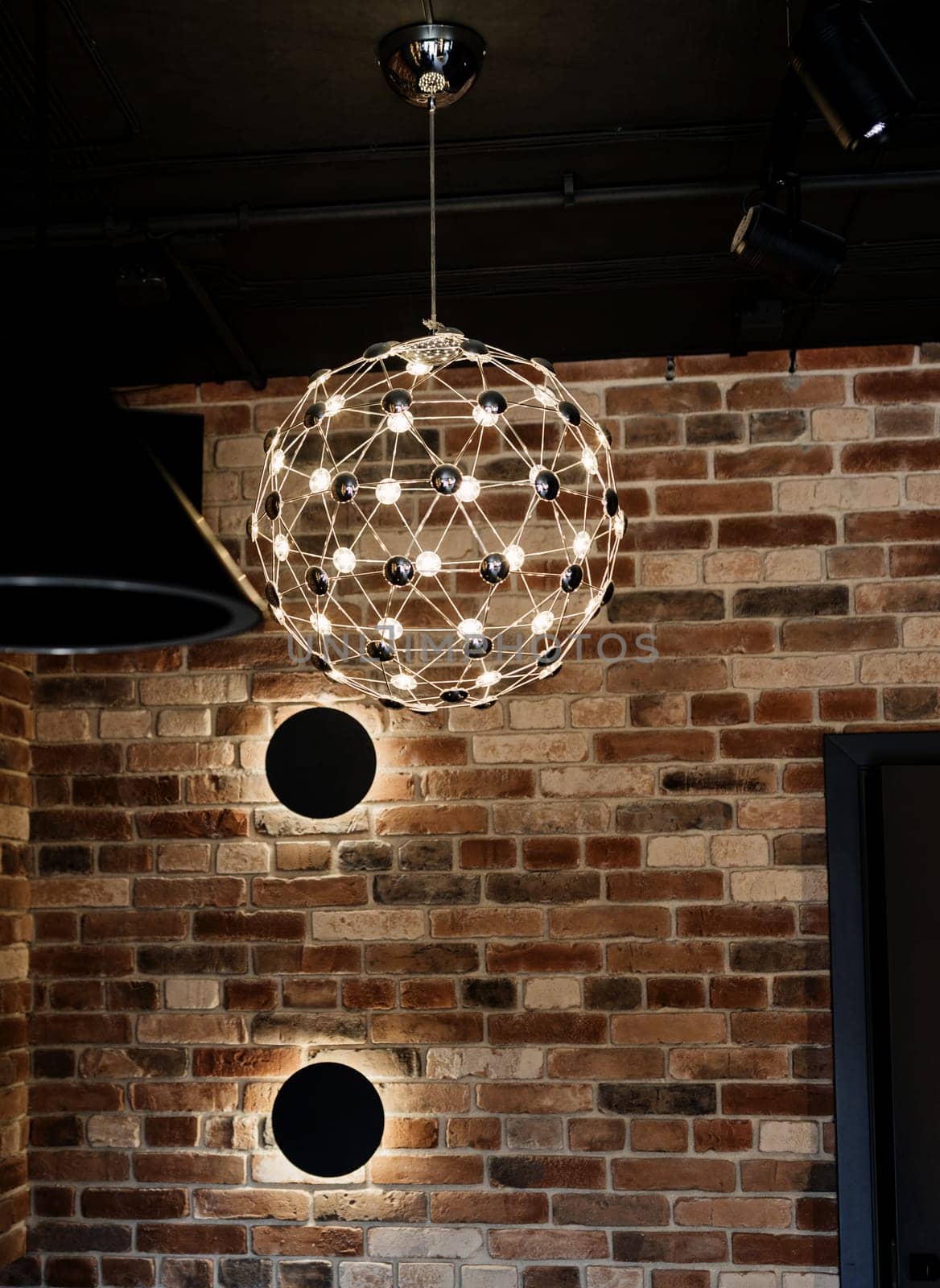 decorative stylish lamp in the loft interior